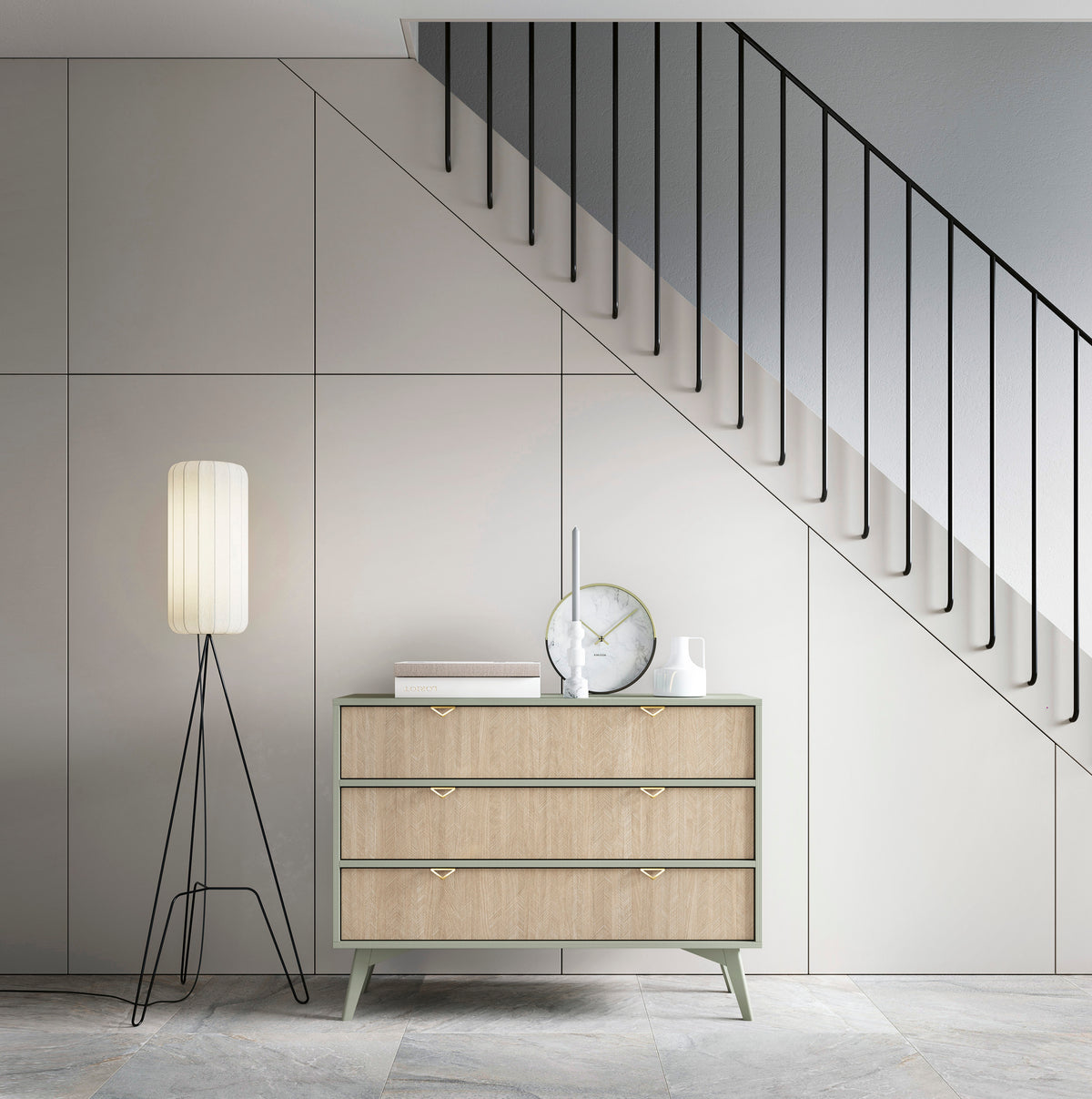 Light wood three-drawer chest with gold triangular handles and slim tapered legs