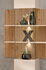 Wood slat wall with built-in lights and white cabinet below