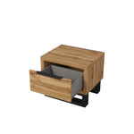 Wood bedside table with open drawer and black base