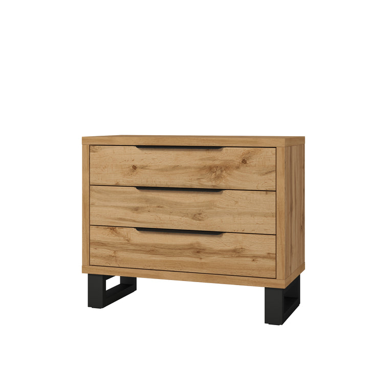 Light wood chest of drawers with three horizontal drawers and dark corner feet.
