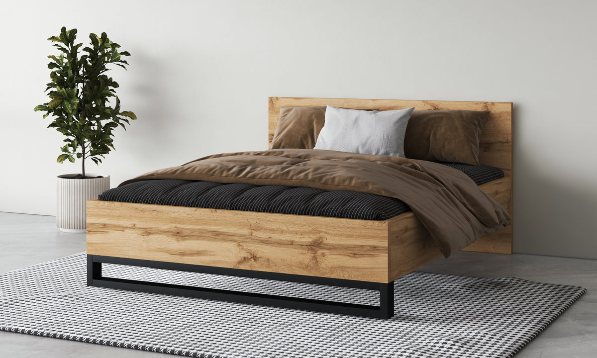 Alin bed frame with light oak headboard and black base, with pillows and quilt
