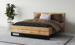 Wood-effect ottoman bed with black metal base, white and brown bedding