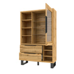 Display cabinet with glass door and open compartments beside two drawers, angled