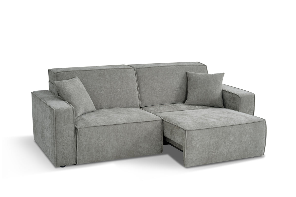 Grey fabric 3-seater sofabed with chaise extension, split cushions, and thick arms