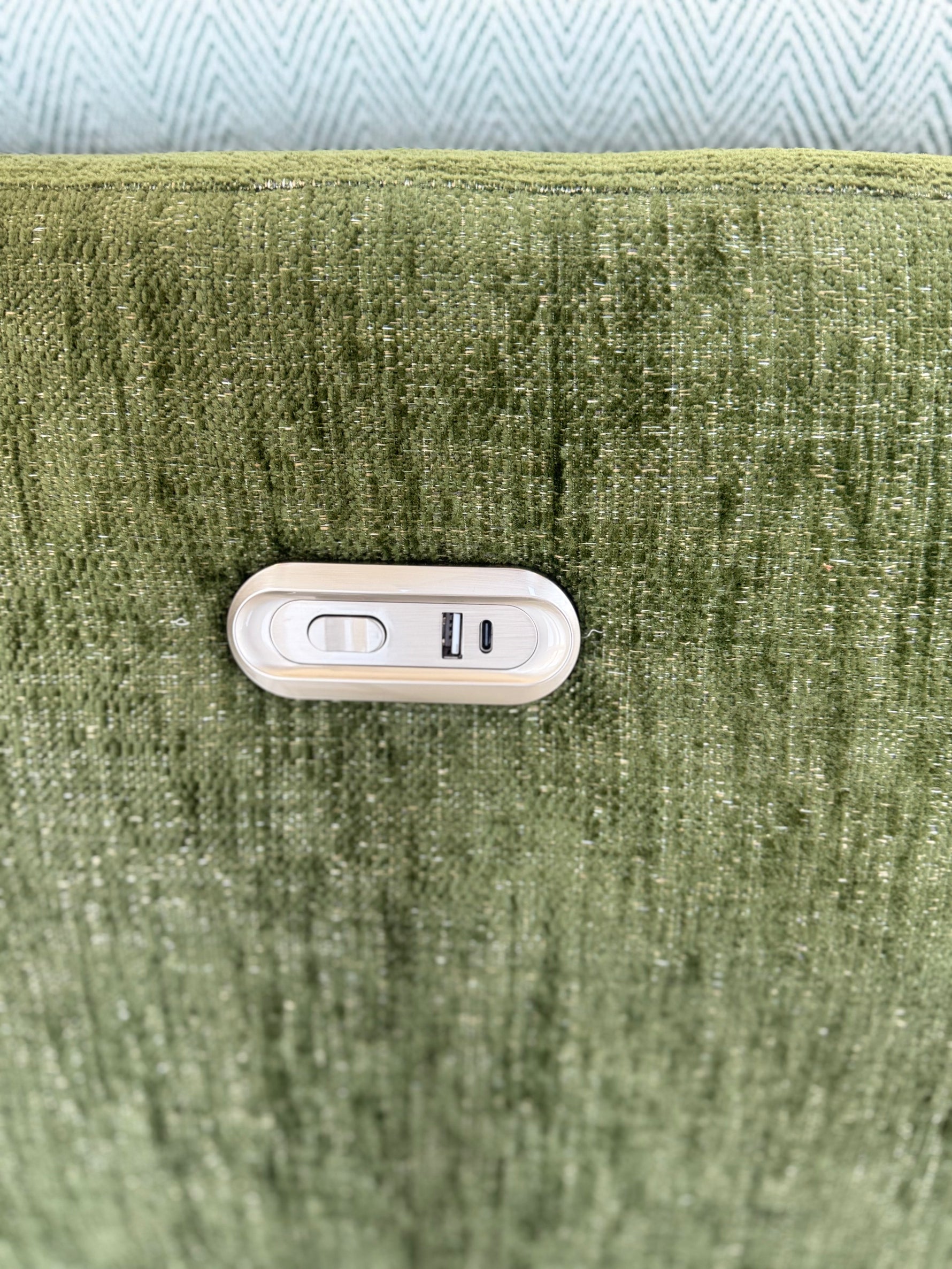 Green sofa upholstery with built-in electric control switch panel