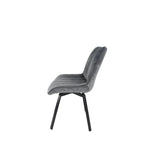 Grey velvet upholstered chair with tall curved back and black tapered legs