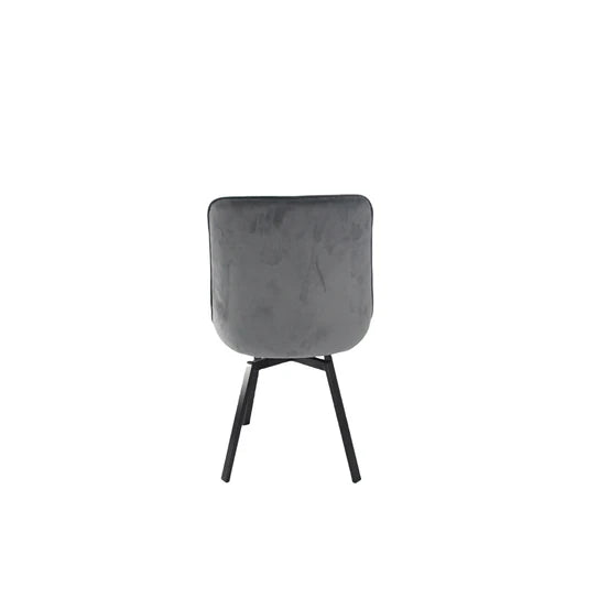 Grey velvet upholstered accent chair with square rounded back and black legs