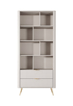 White/beige bookcase with open cubby shelves and ribbed lower cabinet section