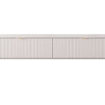 Beige TV cabinet with ribbed drawer fronts and slim light wood legs