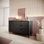 Black ribbed sideboard with two drawers and cabinet doors, gold-tone handles, angled legs