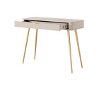 Beige dressing table with open ribbed drawer revealing interior and slim tapered legs