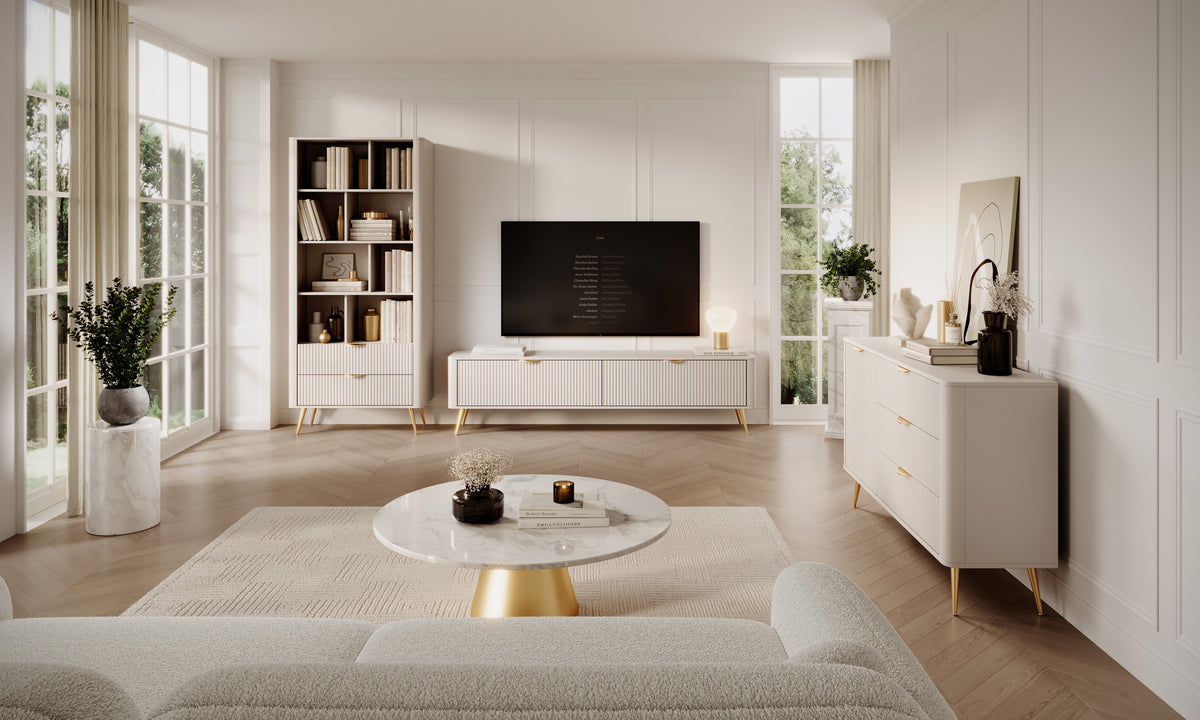 Beige TV cabinet with ribbed doors and gold-tone tapered legs in living room