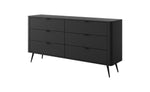 Black chest of drawers with vertical ribbed fronts and gold bar handles, three drawers