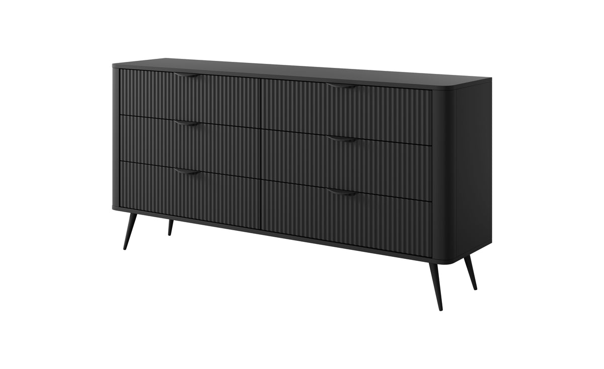 Black chest of drawers with vertical ribbed fronts and gold bar handles, three drawers