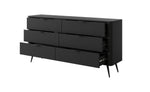 Black chest of drawers with vertical ribbed fronts, open drawer and gold bar handle details
