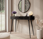 Black dressing table with ribbed drawer front and tapered wooden legs