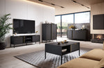 Black coffee table with open shelf and drawers in a living room setting