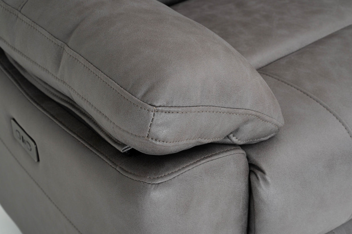 Dark gray recliner seat with padded footrest and visible seam stitching