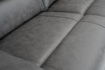 Grey recliner sofa seat cushions with padded backrest and stitched seam lines