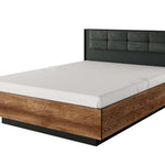King ottoman storage bed with dark gray upholstered headboard and wood side panels, closed