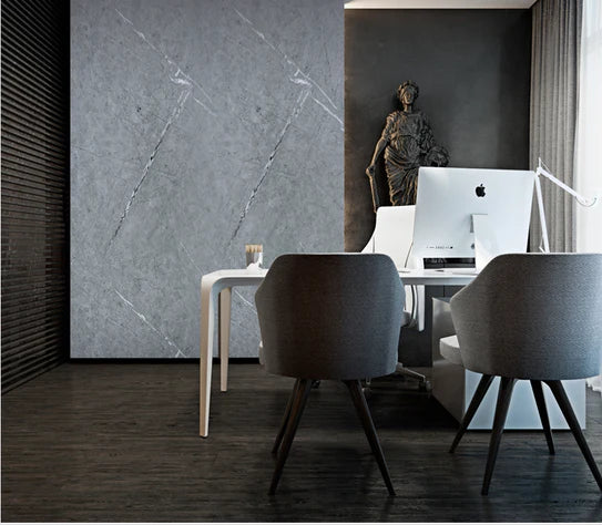 Grey marble-effect wall panel with light veining on interior wall