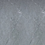 Grey marble-effect wall panel close-up with white veining lines