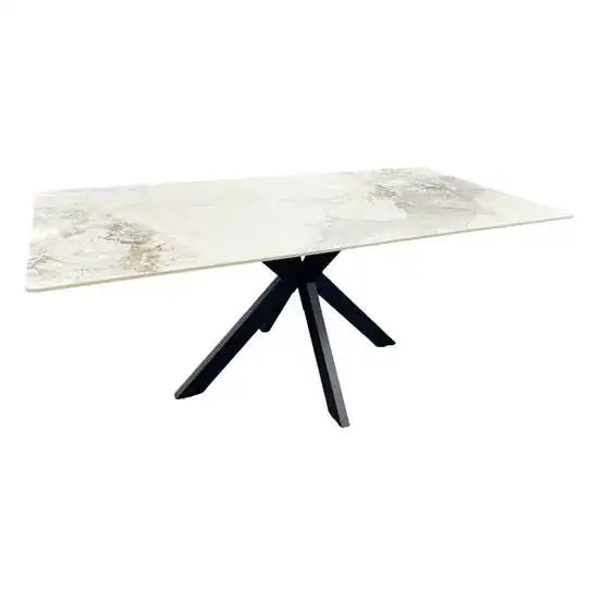 Marble-pattern ceramic table with tapered black tripod-style legs and long top