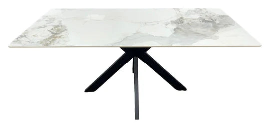 Marble-pattern ceramic table with black tripod legs and wide rectangular top