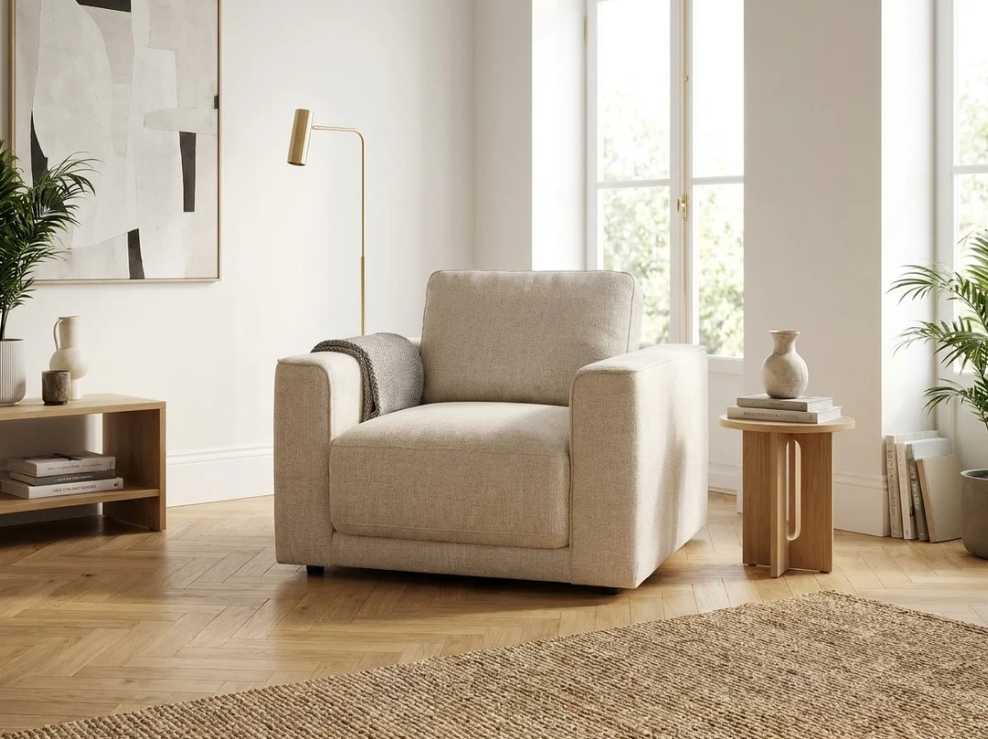 Beige upholstered armchair with rounded arms and square seat