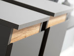 Close-up of TV wall unit drawer interior with light wood insert and dark frame