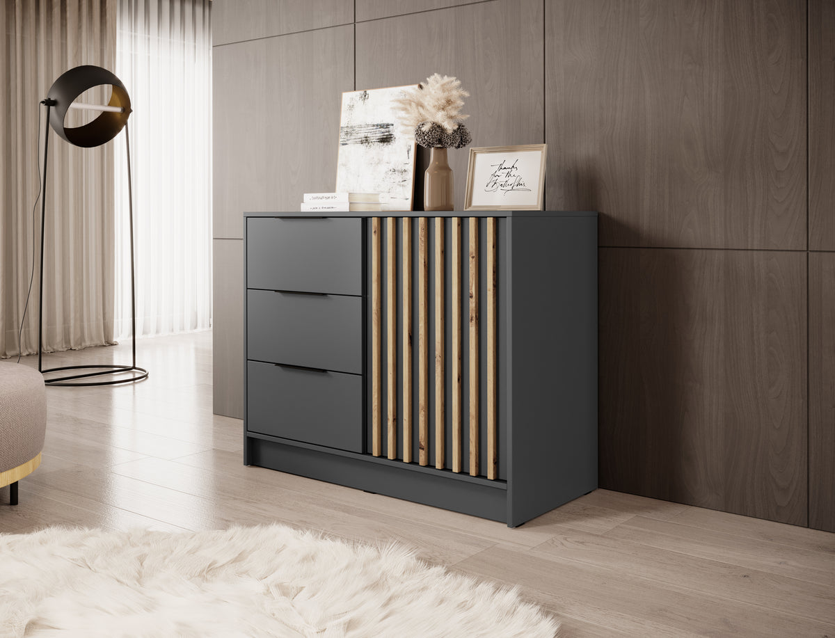 Graphite chest of drawers with three drawers and vertical gold-toned slat door panel