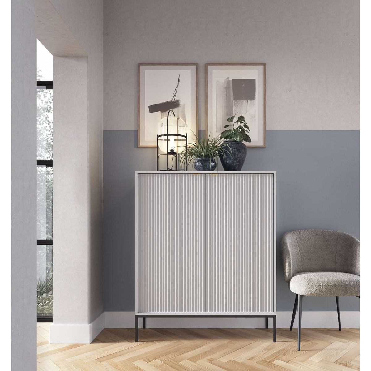 White two-door highboard with vertical ribbed panel doors and black feet