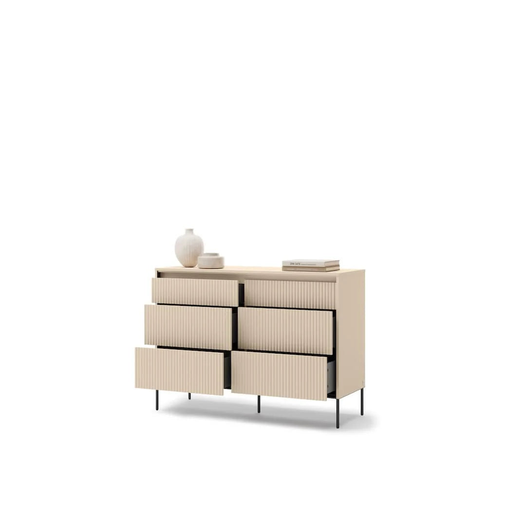Four-drawer dresser with ribbed fronts, boxy frame, and black metal legs