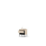Light beige bedside table with open drawer and ribbed front, black tapered legs