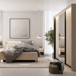 Beige ottoman bed with light gray bedding in a bright room with curtains