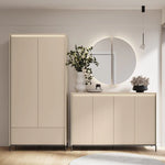 Double-door hallway cabinet with light finish and ribbed base panel in an entryway