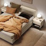 Light beige bedside table with ribbed drawer front and open shelf, black tapered legs