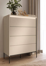 Tall chest of drawers with ribbed front panels and four drawers, on thin metal legs