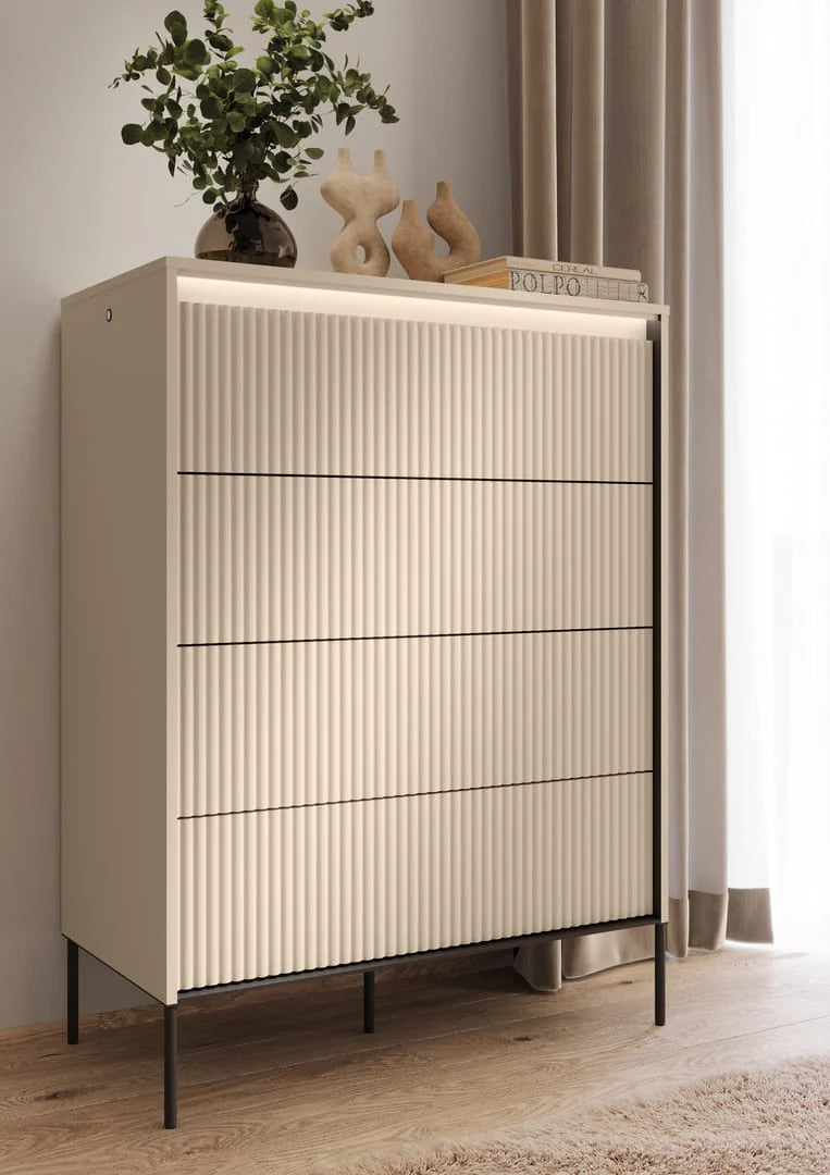 Tall chest of drawers with ribbed front panels and four drawers, on thin metal legs