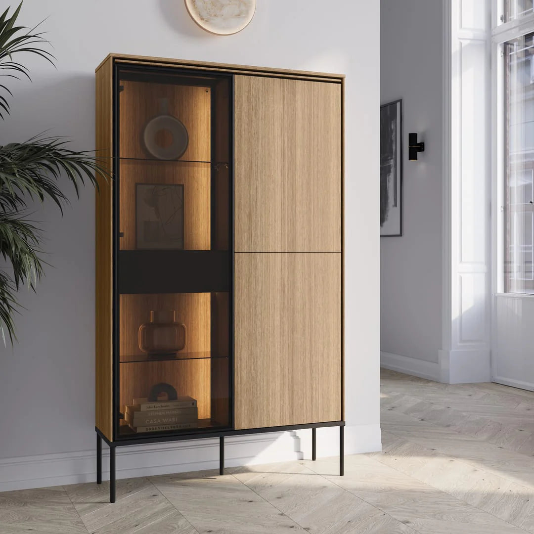 Display cabinet with sliding glass door, light wood frame, and black base legs