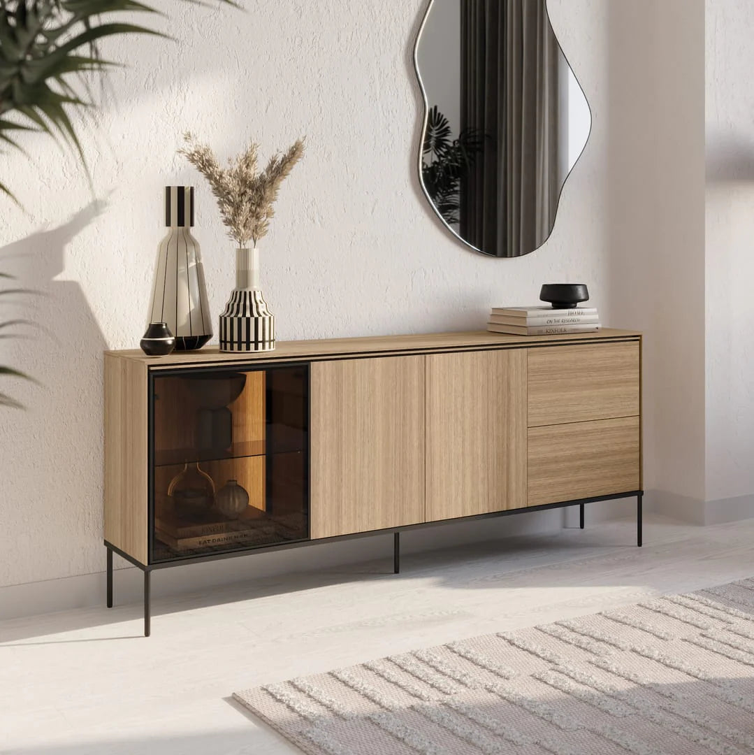 Long display sideboard cabinet with glass door and light oak doors, on slim metal legs