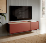 Ceramic red TV console with three cabinet doors and media shelf under a wall TV