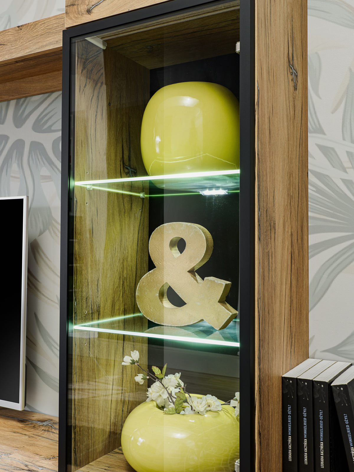 Ray TV wall unit glass door display with LED glow and yellow decorative items inside