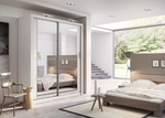 Sliding wardrobe with light gray frame and glass doors, shown in a bedroom setting.