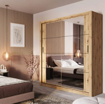 Large light wood sliding wardrobe with frosted glass panels and interior partitions.