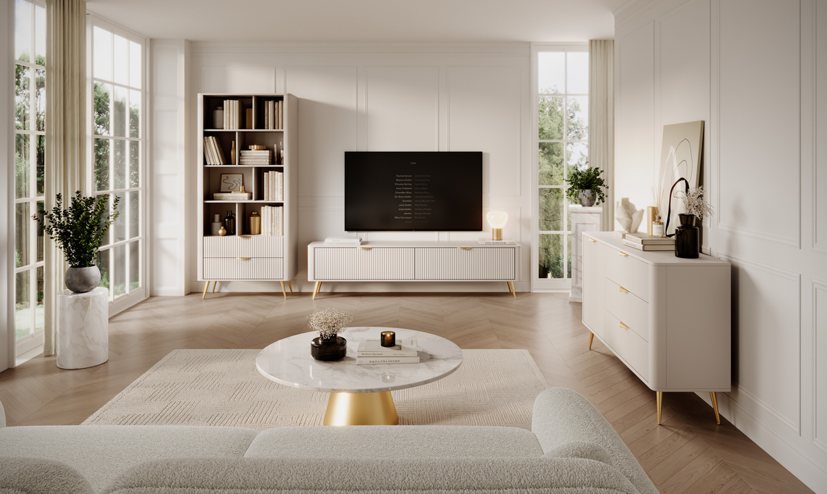 White bookcase with open shelving and ribbed lower cabinet, set in a living room