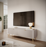 Light TV cabinet with ribbed doors and gold-tone tapered legs