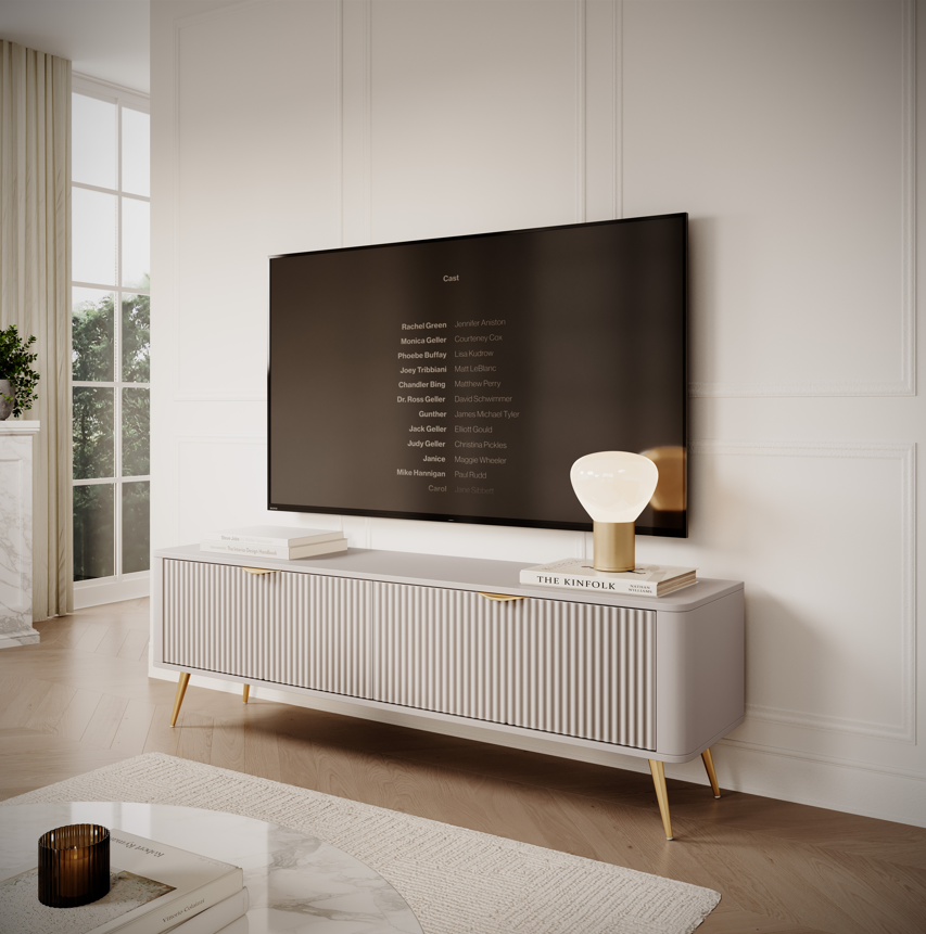 Light TV cabinet with ribbed doors and gold-tone tapered legs