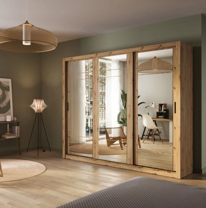 Sliding door wardrobe with wood frame and mirrored doors, shown open in-room