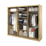 Wood-finish wardrobe interior with hanging clothes, shelves, and storage bins